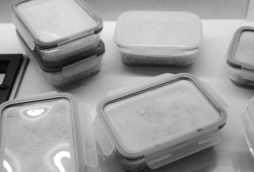 white plastic food container on white table