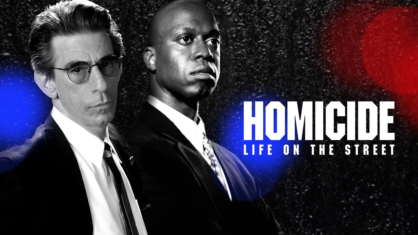This image shows Peacock's (NBC's streaming service's) banner for Paul Attanasio's 1993-2000 television series Homicide: Life on the Street. Over a black, rainy backdrop stand Detective John Munch (played by Richard Belzer, far left) and Detective Frank Pembleton (played by Andre Braugher, center). The program's official title design (in white, block letters) appears on the right, with a police vehicle's red and blue lights visible at three different locations (left, right, and center) throughout this banner. This image shows Peacock's (NBC's streaming service's) banner for Paul Attanasio's 1993-2000 television series Homicide: Life on the Street. Over a black, rainy backdrop stand Detective John Munch (played by Richard Belzer, far left) and Detective Frank Pembleton (played by Andre Braugher, center). The program's official title design (in white, block letters) appears on the right, with a police vehicle's red and blue lights visible at three different locations (left, right, and center) throughout this banner.