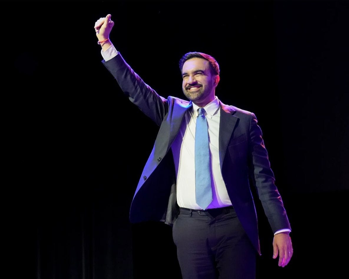 May be an image of one or more people, beard and suit