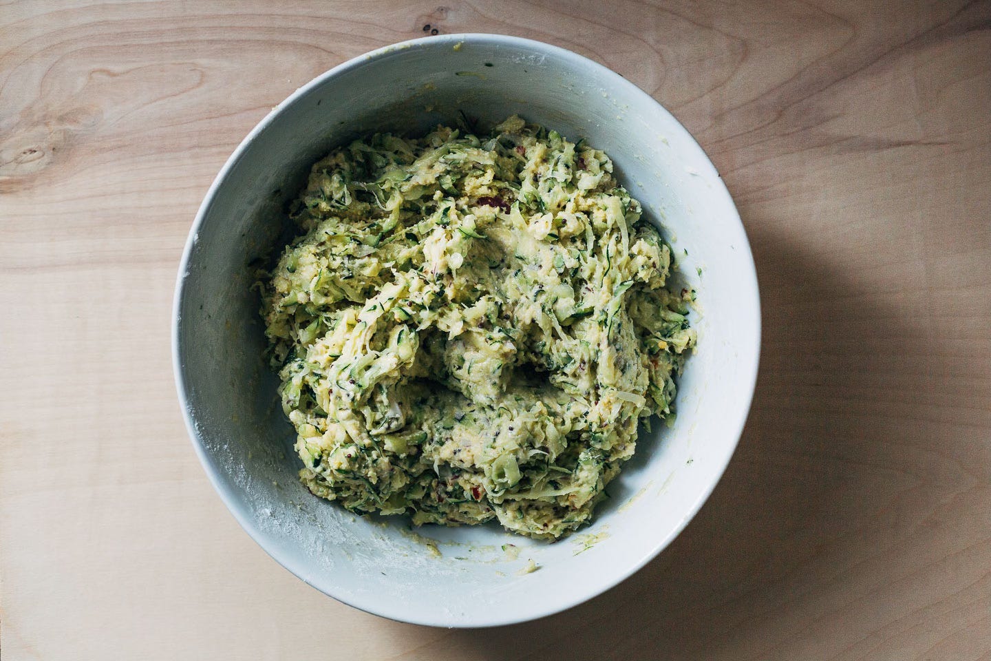 A bowl of fritter dough