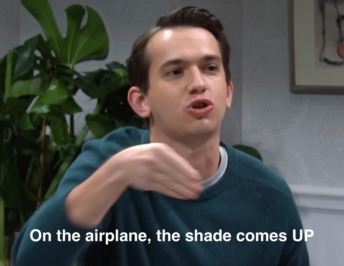 Andrew Dismukes from the SNL Jumanji sketch with the caption "On the airplane, the shade comes UP"