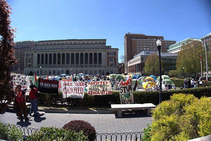 File:Columbia Encampment and Protestors being interviewed.jpg
