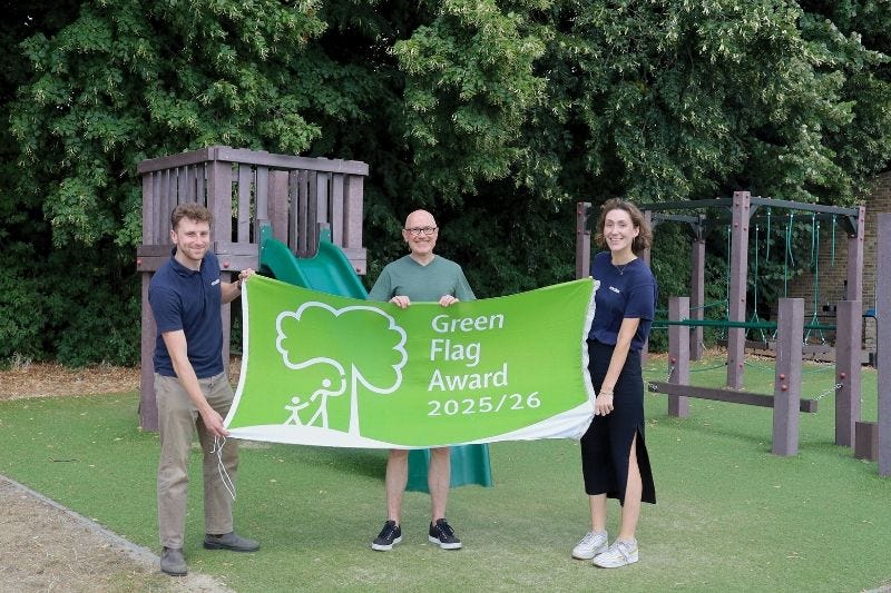 May be an image of 3 people, grass, tree and text