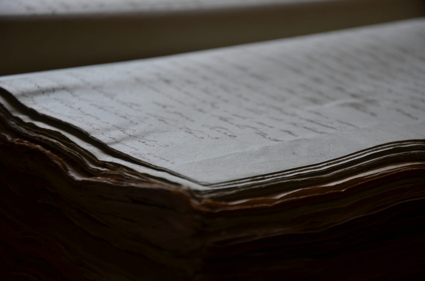Stacks of paper covered with hand-written quotes