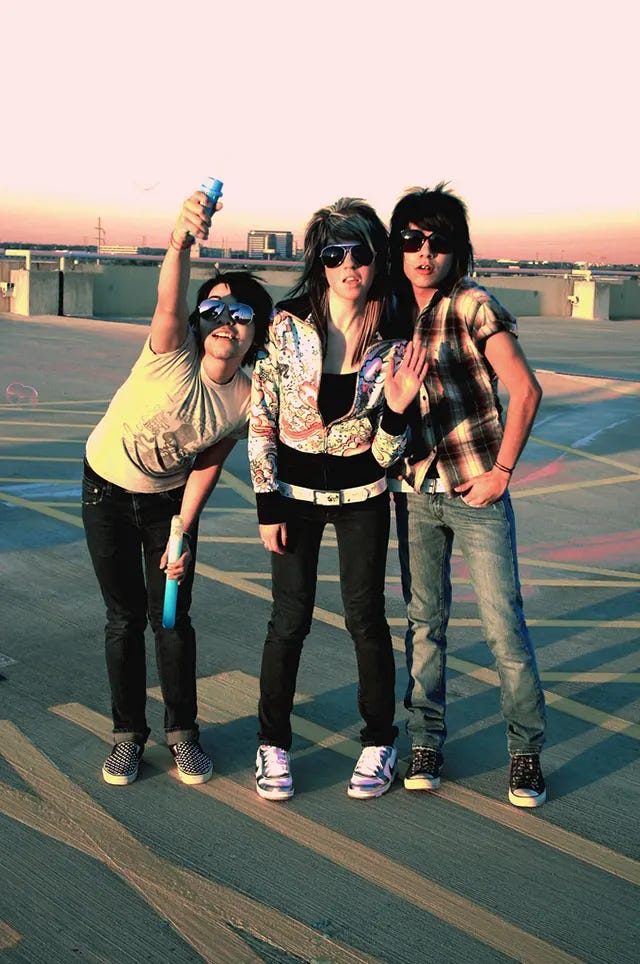 Scene kids in 2008, showcasing their distinctive blend of vibrant colors, straightened hair, and alternative fashion. Scene kids in 2008, showcasing their distinctive blend of vibrant colors, straightened hair, and alternative fashion.