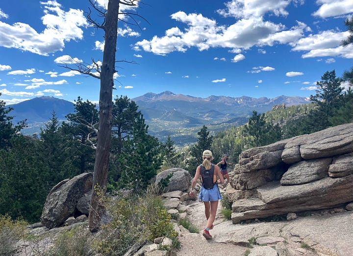 Left photo: Lauren, Clara and Liz smiling at the camera with the Franconia Ridge in the background. It is winter and the mountains are covered with snow. Right photo: Adrienne running away from the camera in the mountains, with beautiful ridge lines and blue skies in the background.