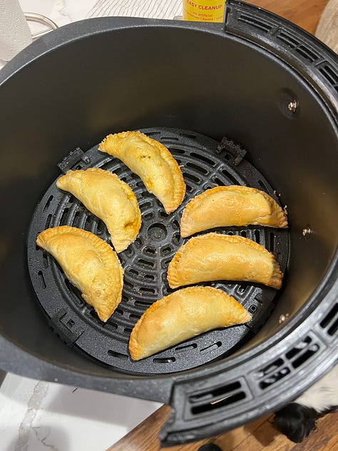 A gallery of air fryer creations including falafel, empanadas, shrimp po' boys and egg souffle.