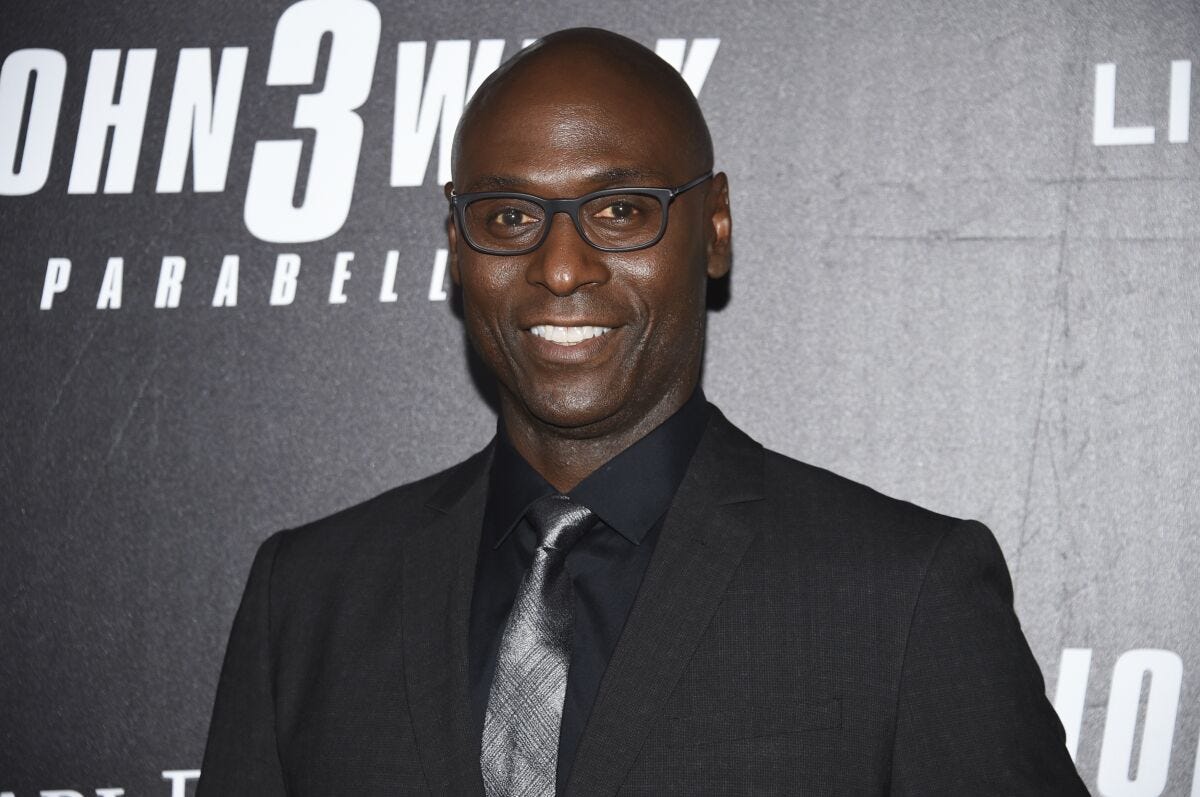 Actor Lance Reddick smiles at a movie premiere Actor Lance Reddick smiles at a movie premiere