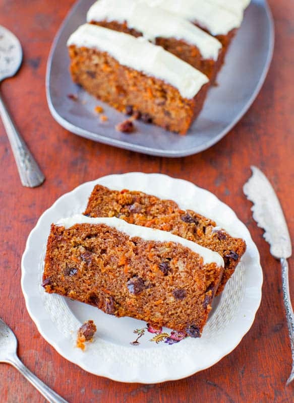 Slices of carrot cake loaf on a white plate.