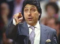 A person in a suit pointing his finger

AI-generated content may be incorrect.