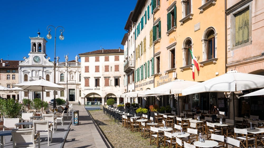 May be an image of 2 people, Camogli and the Arno River
