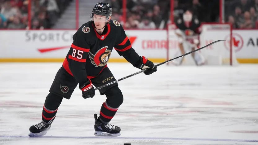 Jake Sanderson winds up for a slap shot