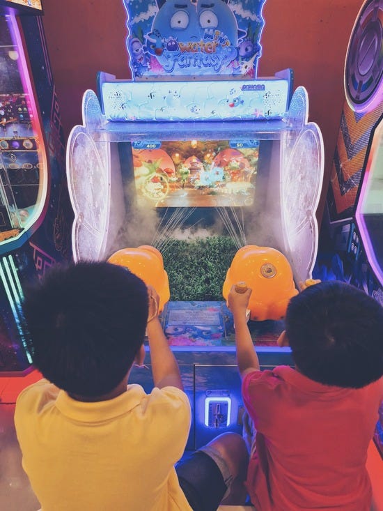 two boys playing an interactive game two boys playing an interactive game