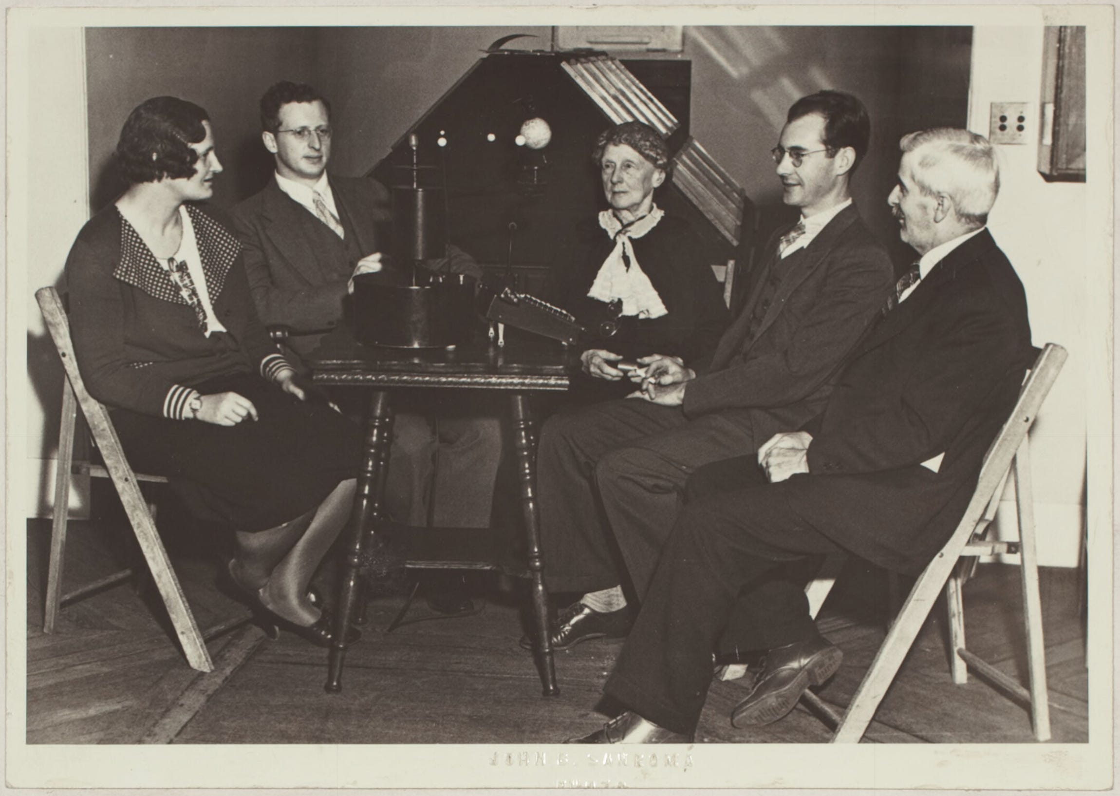Donald Menzel, second from left, in 1932 running a mechanical computer, called an orrery, while other Harvard astronomers look on. From left to right: Celia Helena Payne-Gaposchkin, Donald H. Menzel, Annie Jump Cannon, Fred L. Whipple, and Leon Campbell. Donald Menzel, second from left, in 1932 running a mechanical computer, called an orrery, while other Harvard astronomers look on. From left to right: Celia Helena Payne-Gaposchkin, Donald H. Menzel, Annie Jump Cannon, Fred L. Whipple, and Leon Campbell.