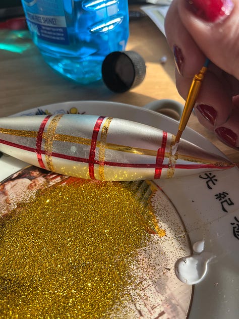 I kicked off the holiday season by doing one of my new favorite things: refreshing glitter on vintage ornaments. These beauties were covered in blackened glitter so I scraped that off using a small straight pin, dusted them and then used a small paintbrush to place glue where the old glitter had been. Then I dusted them with fresh glitter and VOILA! They are gorgeous once more. I've done this many times while watching TV and it's SO rewarding. 