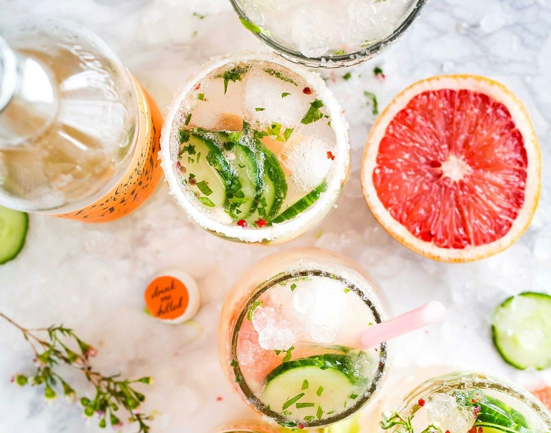 flatlay photography of sliced fruits and cucumbers
