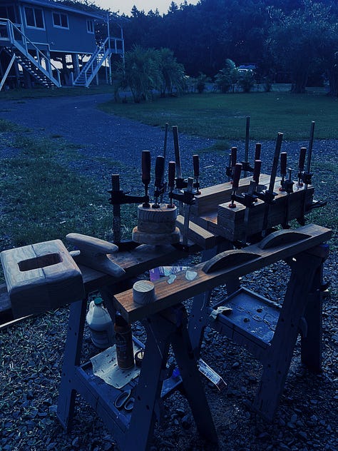 left is a sailing pueo handmade of wood, middle is a photo of wood projects for the canoe being clamped, and right is a photo from chriss POV of him climbing the mast to fix something he miscalculated on purpose to climb the mast