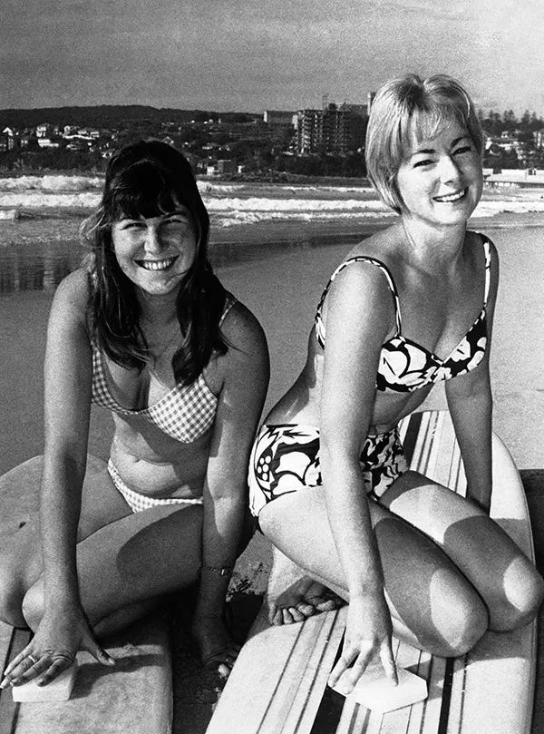 Australian Maureen Horsley and American champion Linda Benson prepare for the World Surfboard Riding Championships at Sydney's Manly Beach, 1964. Australian Maureen Horsley and American champion Linda Benson prepare for the World Surfboard Riding Championships at Sydney's Manly Beach, 1964.