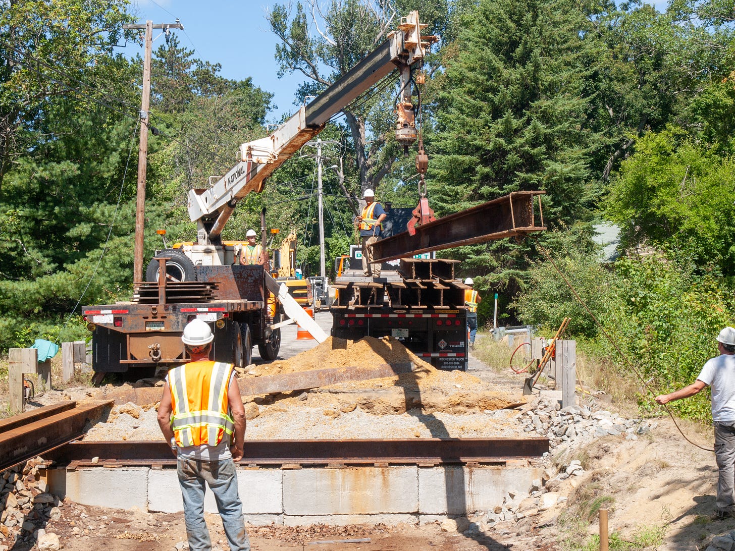 workmen removing bridge