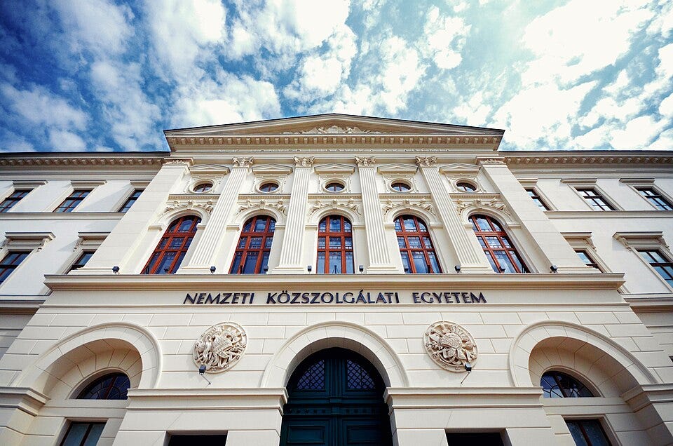 The main building of Hungary’s National University of Public Service, known as Ludovika, where academic conferences reportedly provided cover for meetings between Mahmoud Ahmadinejad and Israeli intelligence. Credit line Photo: NUPSInternational/Wikimedia Commons, CC BY-SA 4.0. Cropped. The main building of Hungary’s National University of Public Service, known as Ludovika, where academic conferences reportedly provided cover for meetings between Mahmoud Ahmadinejad and Israeli intelligence. Credit line Photo: NUPSInternational/Wikimedia Commons, CC BY-SA 4.0. Cropped.