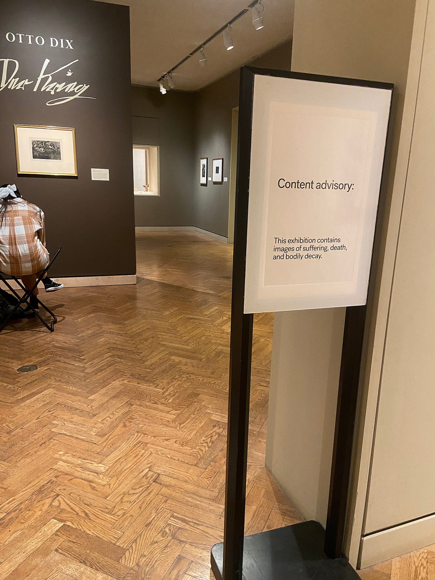 Content advisory sign at Otto Dix exhibition at the MIA Content advisory sign at Otto Dix exhibition at the MIA