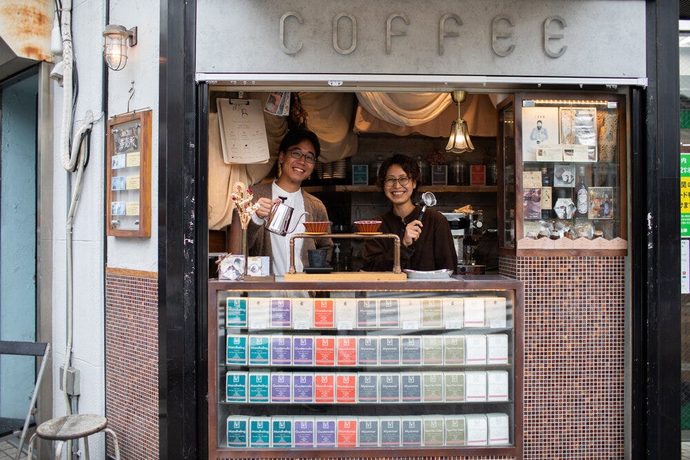 All smiles at the Mamebaco Coffee Stand in Kyoto.