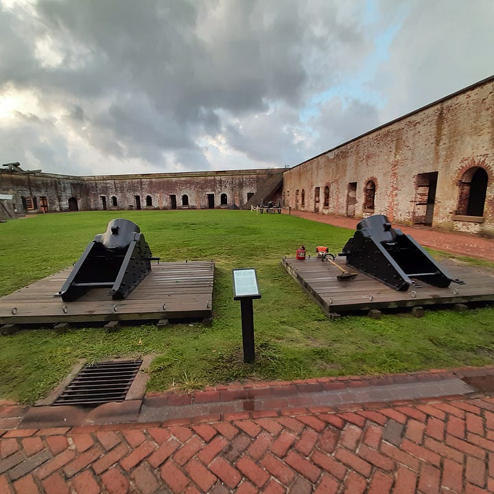 Different kinds of artillery pieces, both large and small.