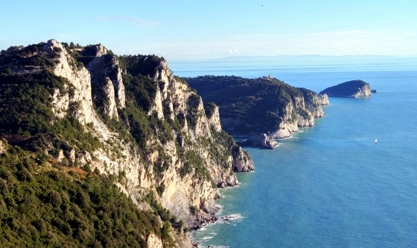The costal ridge of Muzzerone adn its cliffs falling on the sea, with Palmaria island on the background.
