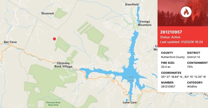 May be an image of map, road and text that says 'Shumont Deerfield Bat Cave Youngs Mountain 261210957 Status: Active Last updated: 01/02/26 16 16:24 Chimney Rock RockVillage Village M COUNTY Rutherford County DISTRICT District 12 FIRE SIZE: 20.4 CONTAINMENT 75% Lake Lure COORDINATES 35° 27' 18.64" N 82° 15' 12.30" N Chimney ChimneyRock Rock StatePark Park NUMBER: 261210957 CATEGORY: Wildfire Lake LakeLure Lure' May be an image of map, road and text that says 'Shumont Deerfield Bat Cave Youngs Mountain 261210957 Status: Active Last updated: 01/02/26 16 16:24 Chimney Rock RockVillage Village M COUNTY Rutherford County DISTRICT District 12 FIRE SIZE: 20.4 CONTAINMENT 75% Lake Lure COORDINATES 35° 27' 18.64" N 82° 15' 12.30" N Chimney ChimneyRock Rock StatePark Park NUMBER: 261210957 CATEGORY: Wildfire Lake LakeLure Lure'