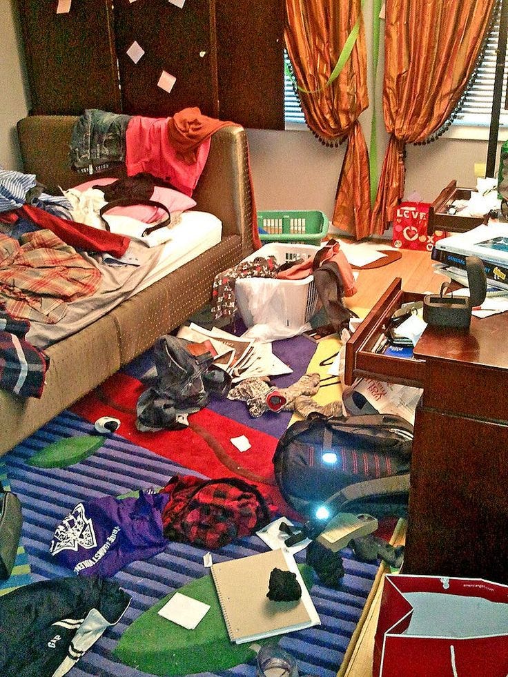 This may contain: a messy bedroom with clothes scattered all over the floor This may contain: a messy bedroom with clothes scattered all over the floor