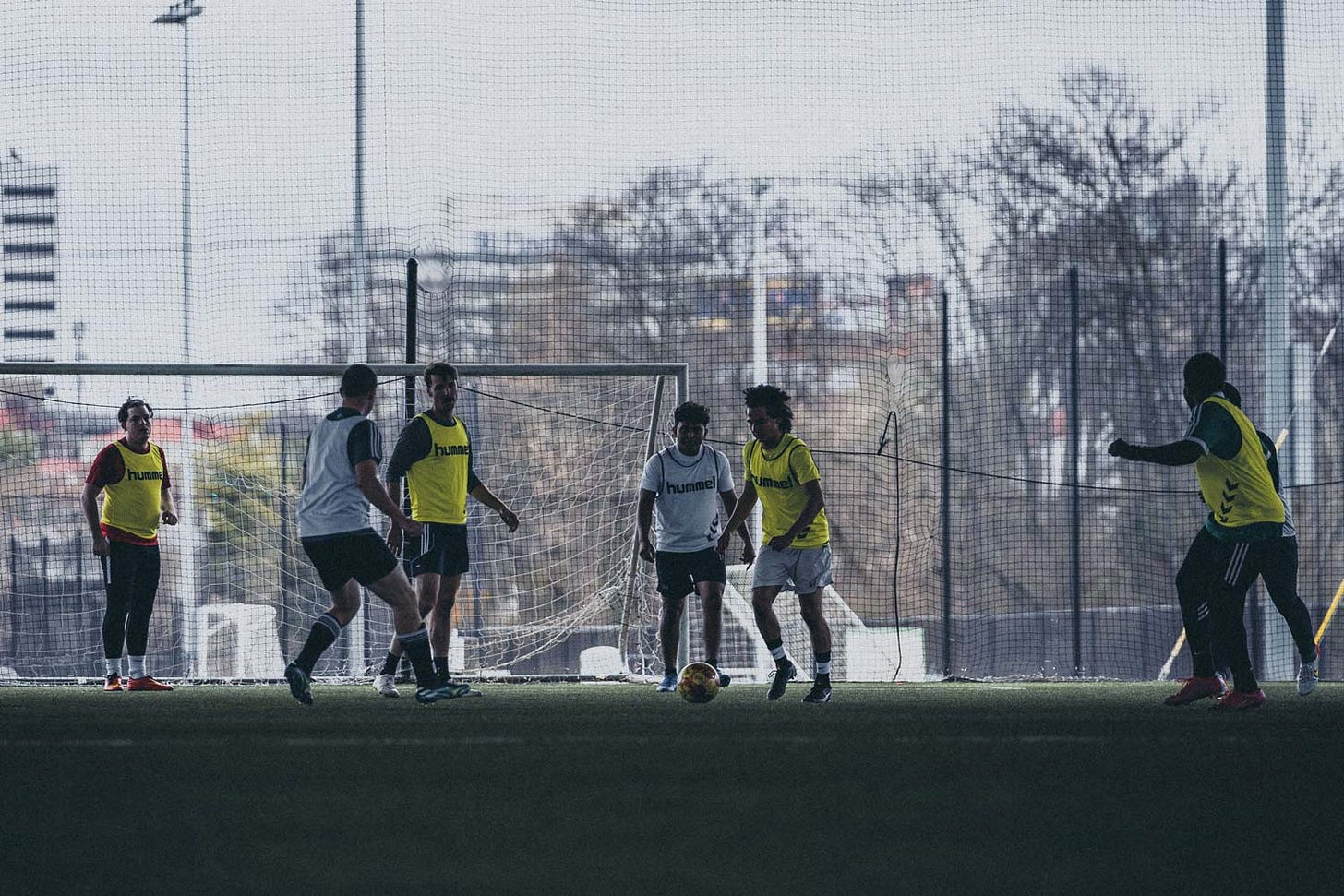 Guys playing pick-up soccer