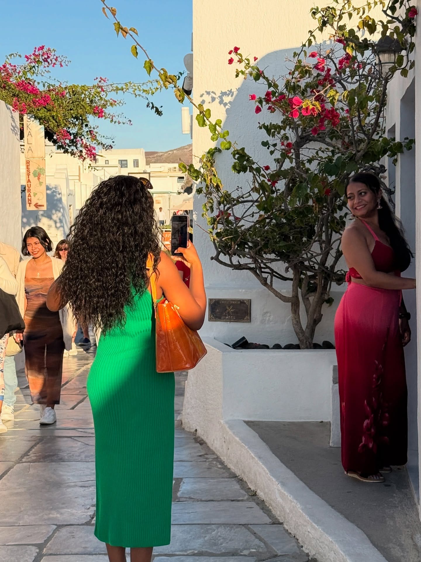 May be an image of one or more people and Santorini May be an image of one or more people and Santorini