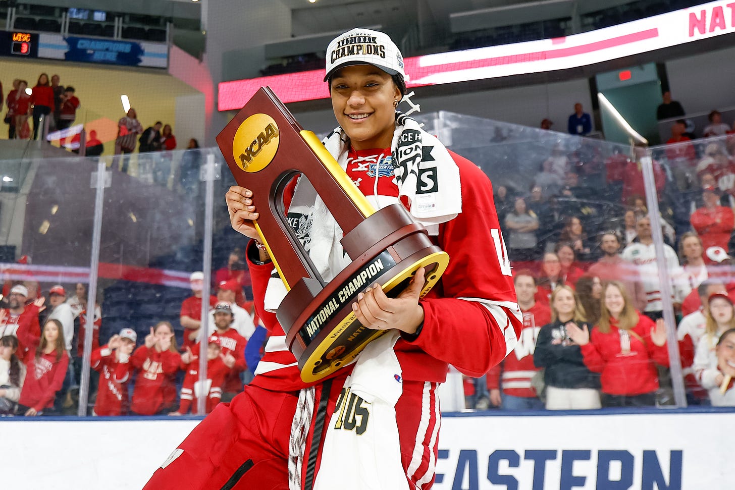 Laila Edwards poses holding the national championship trophy