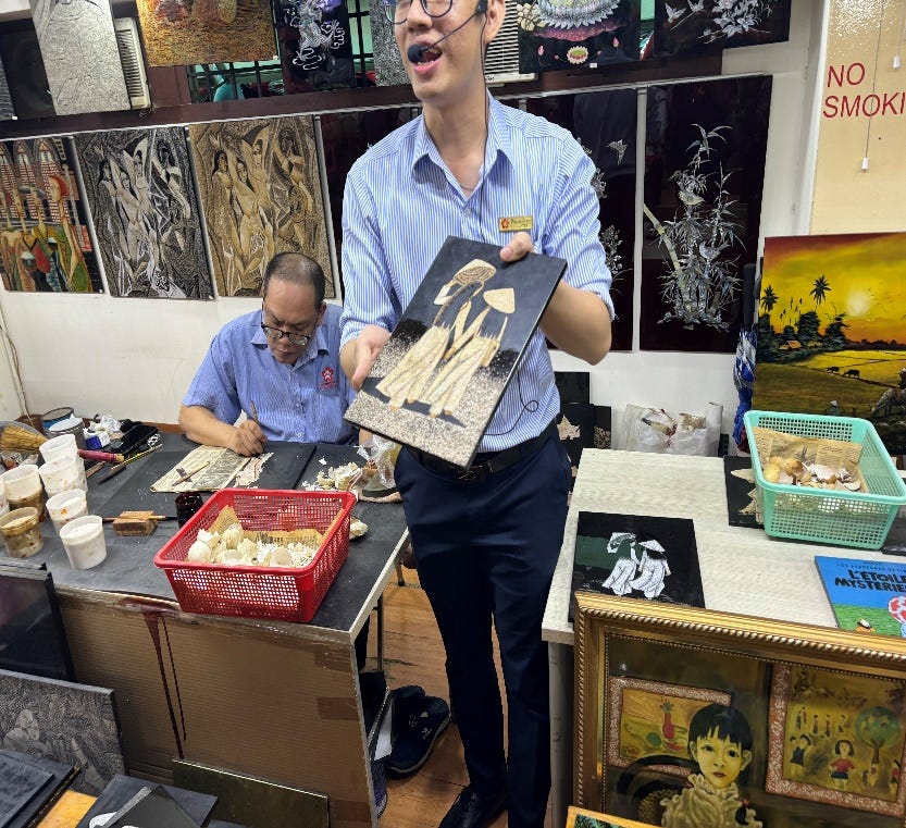 A person holding a piece of art

Description automatically generated