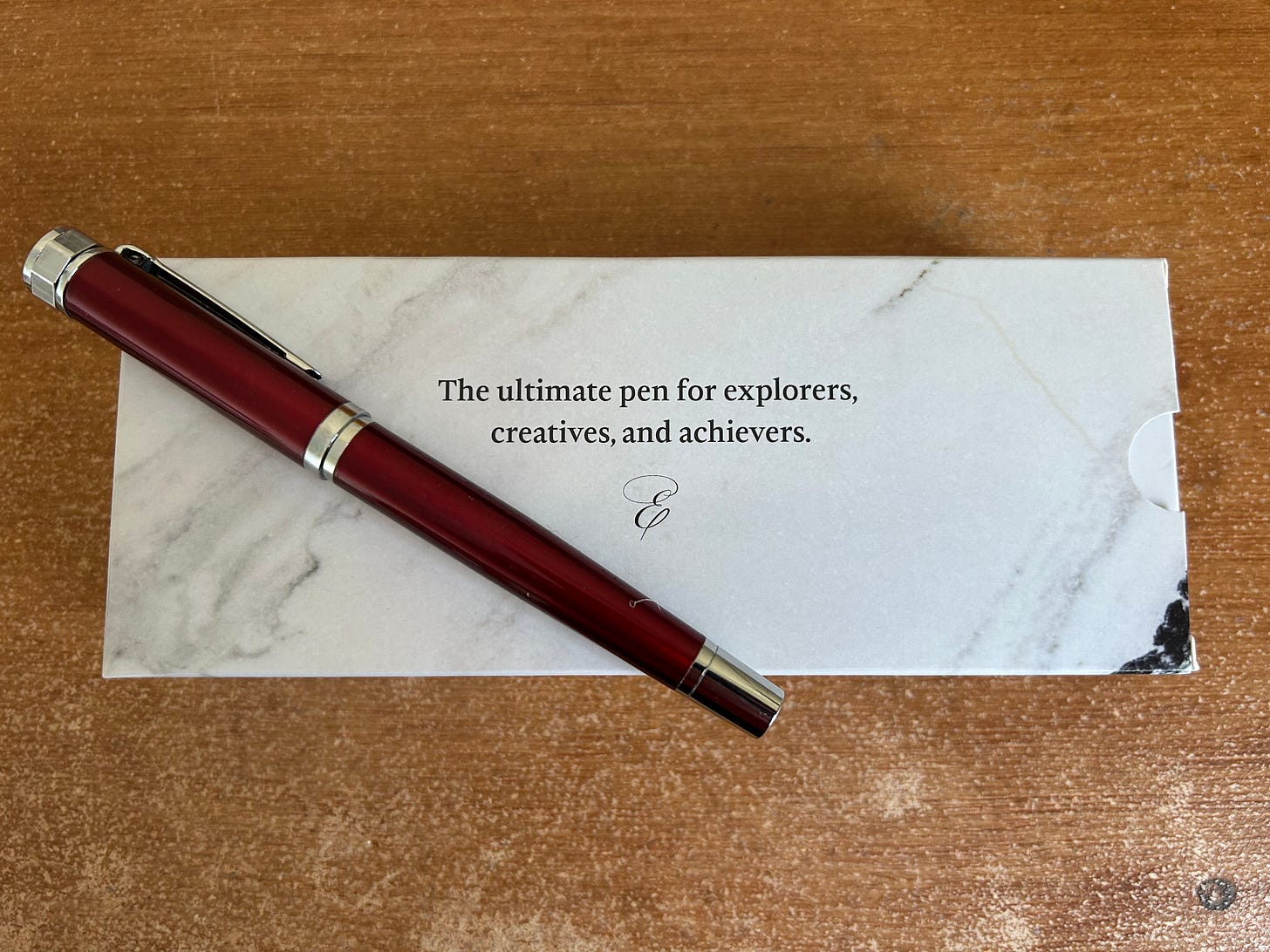 A scarlet slate Ellington Classic Fountain pen laid on it's box Image: Roland Millward