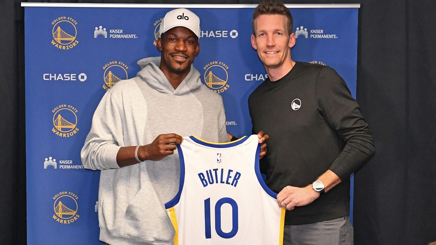 Jimmy Butler #10 of the Golden State Warriors poses for a photo with Michael Joseph Dunleavy Jr. during a press conference before the game against the Los Angeles Lakers Jimmy Butler #10 of the Golden State Warriors poses for a photo with Michael Joseph Dunleavy Jr. during a press conference before the game against the Los Angeles Lakers
