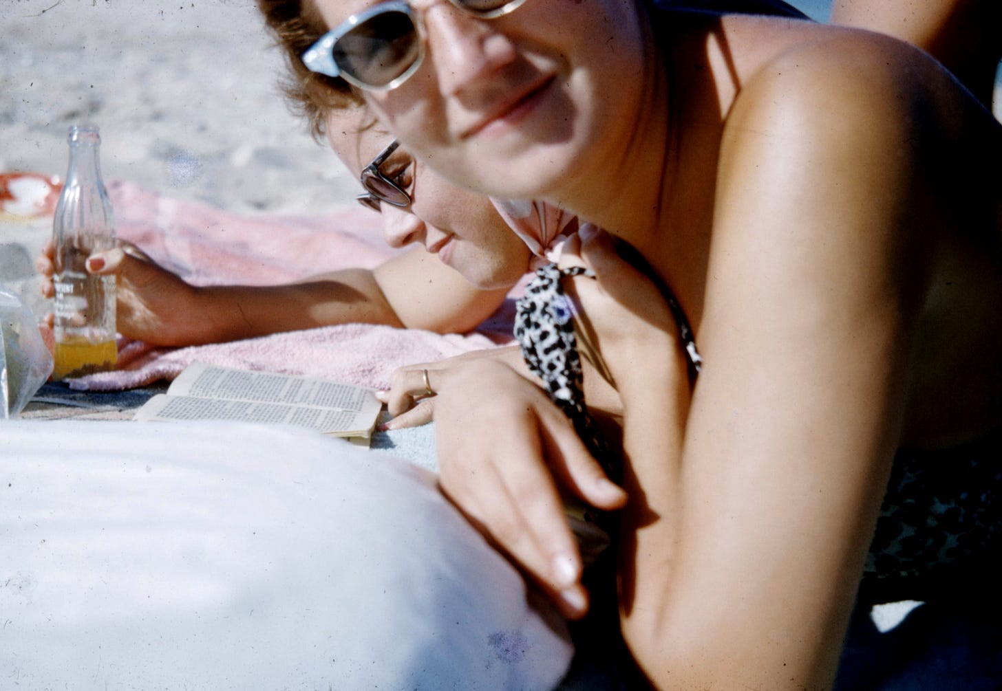 woman in black and white polka dot bikini top wearing sunglasses