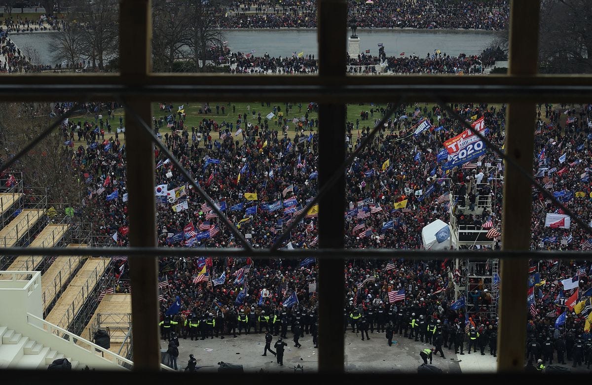 Supporters of US President Donald Trump gather outside the US Capitol’s Rotunda on January 6, 2021, in Washington, DC. - Demonstrators breeched security and entered the Capitol as Congress debated the a 2020 presidential election Electoral Vote Certification. (Photo by Olivier DOULIERY / AFP) (Photo by OLIVIER DOULIERY/AFP via Getty Images)