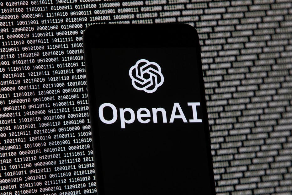 The OpenAI logo appears on a mobile phone. The OpenAI logo appears on a mobile phone.