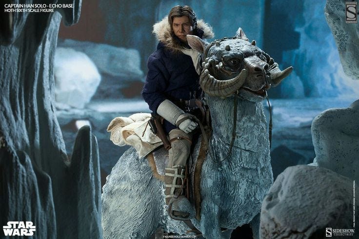 This may contain: a man riding on the back of a white horse next to ice formations and snow This may contain: a man riding on the back of a white horse next to ice formations and snow