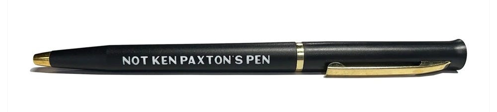 photo of campaign swag, a black ballpoint pen with 'NOT KEN PAXTON'S PEN' in all-caps white lettering on the side. photo of campaign swag, a black ballpoint pen with 'NOT KEN PAXTON'S PEN' in all-caps white lettering on the side.
