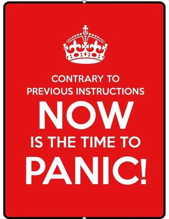 Red sign, big white letters, "Contrary to previous instructions, now is the time to panic!"