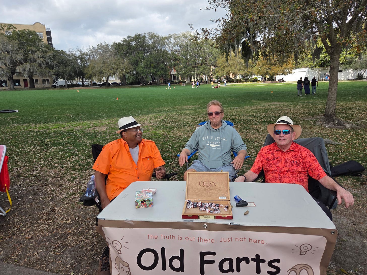 A group of men sitting at a table
AI-generated content may be incorrect.