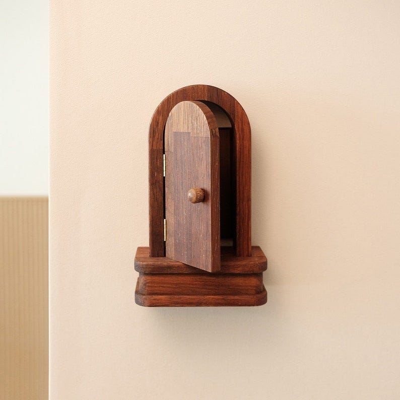 May include: A wooden door with a knob, open and set into a wooden frame. The door is a light brown color and the frame is a darker brown color. May include: A wooden door with a knob, open and set into a wooden frame. The door is a light brown color and the frame is a darker brown color.