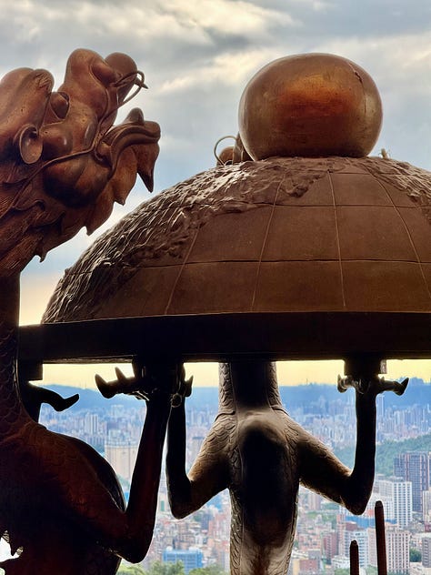 Images from a gondola right and temple visits in Taipei