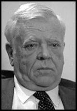 A person in a suit and tie

AI-generated content may be incorrect.