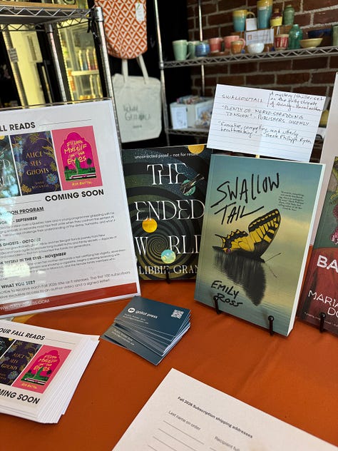 Images of Galiot Press books displayed on a table inside a café