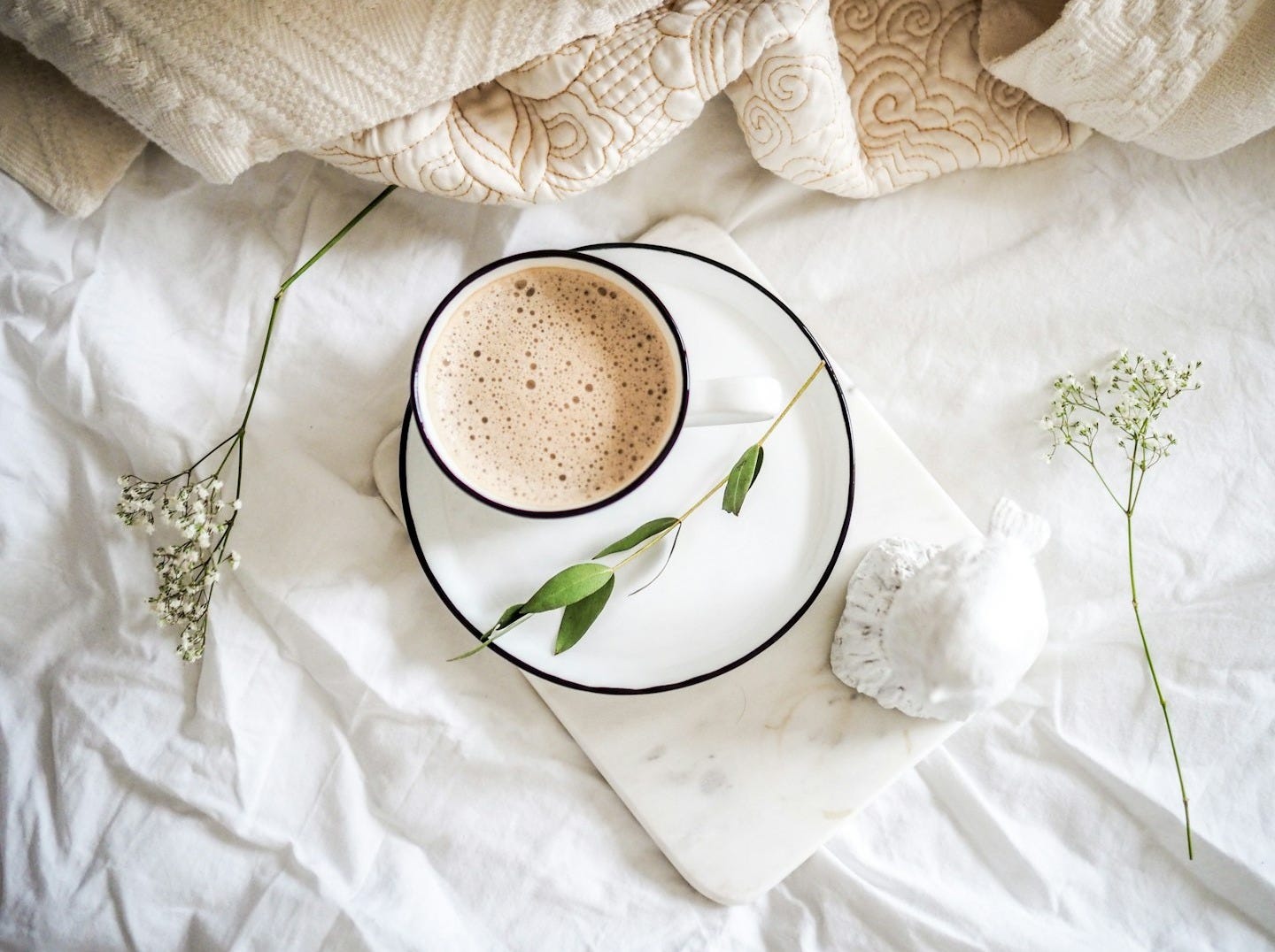 white teacup filled with coffee