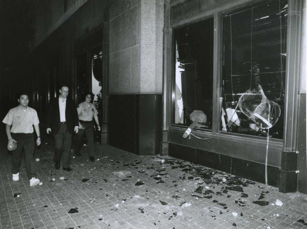 Broken-out windows of the Los Angeles Times building on Spring Street south of 1st Street in the aftermath of the Rodney King trial. Broken-out windows of the Los Angeles Times building on Spring Street south of 1st Street in the aftermath of the Rodney King trial.