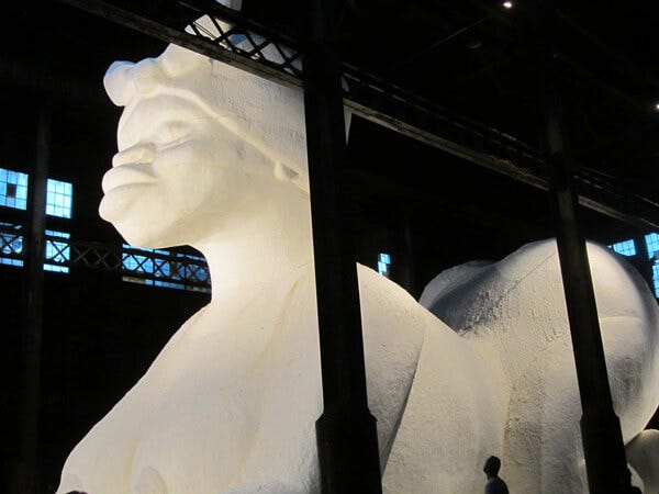 The Sugar Baby sphinx inside Kara Walker's A Subtlety, Brooklyn, New York, 2014. Photograph by Valérie Loichot. Courtesy of Valérie Loichot. The Sugar Baby sphinx inside Kara Walker's A Subtlety, Brooklyn, New York, 2014. Photograph by Valérie Loichot. Courtesy of Valérie Loichot.